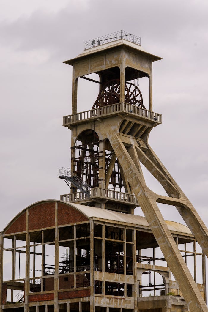 A detailed view of a historic coal mine shaft in Maasmechelen, showcasing industrial heritage.